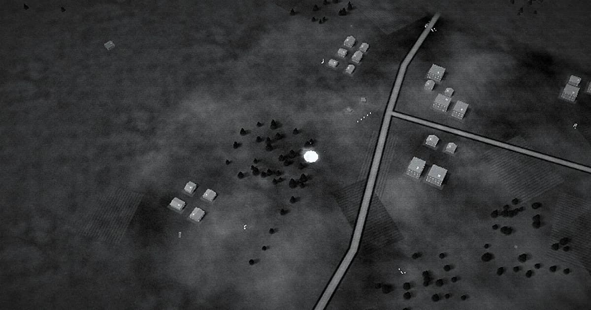 Black-and-white thermal camera view of a village, roads and trees from above